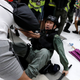 An activist scuffles with a police officer in a Hong Kong mall, July 14, 2019.
